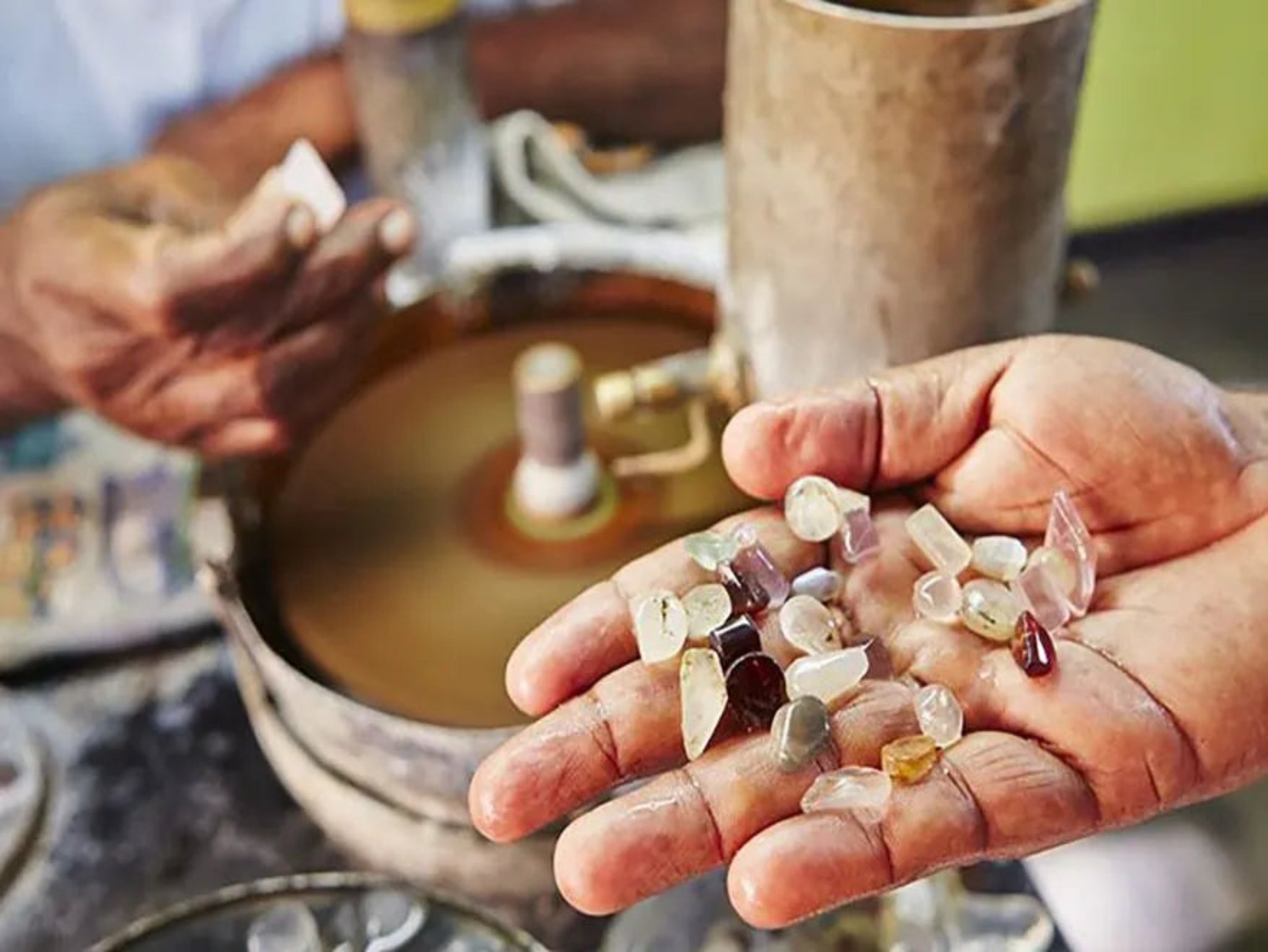 Close-up of rough gemstones freshly mined in Sri Lanka, showcasing the natural beauty and raw form of the stones before they are cut and polished.