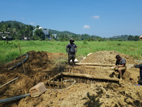 Traditional gem mining in Sri Lanka, showcasing artisanal methods passed down through generations, as miners carefully extract gemstones from the earth.