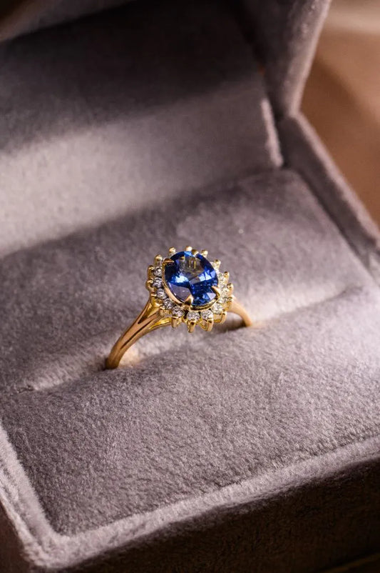 Custom 1.46ct cornflower blue sapphire ring in 18K yellow gold with diamond accents, crafted as a timeless gift.