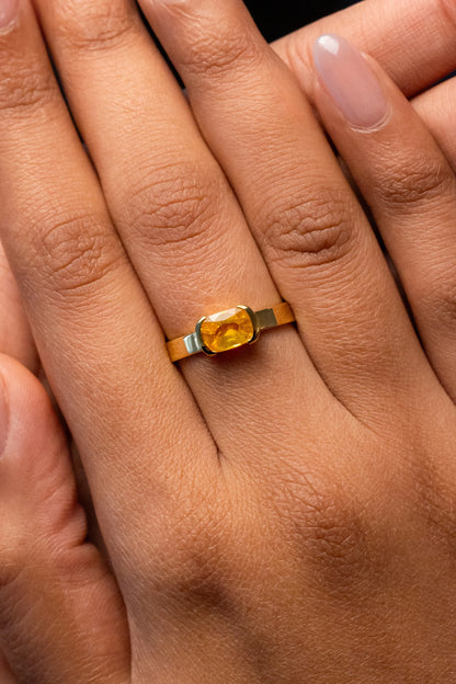 Close-up of 14K yellow gold ring with a 1.24ct Sri Lankan yellow sapphire, set in a simple and elegant bezel design for timeless appeal.
