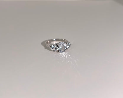 18K white gold engagement ring with a stunning 1.4ct unheated white sapphire and two 0.5ct side sapphires, highlighting its elegance.
