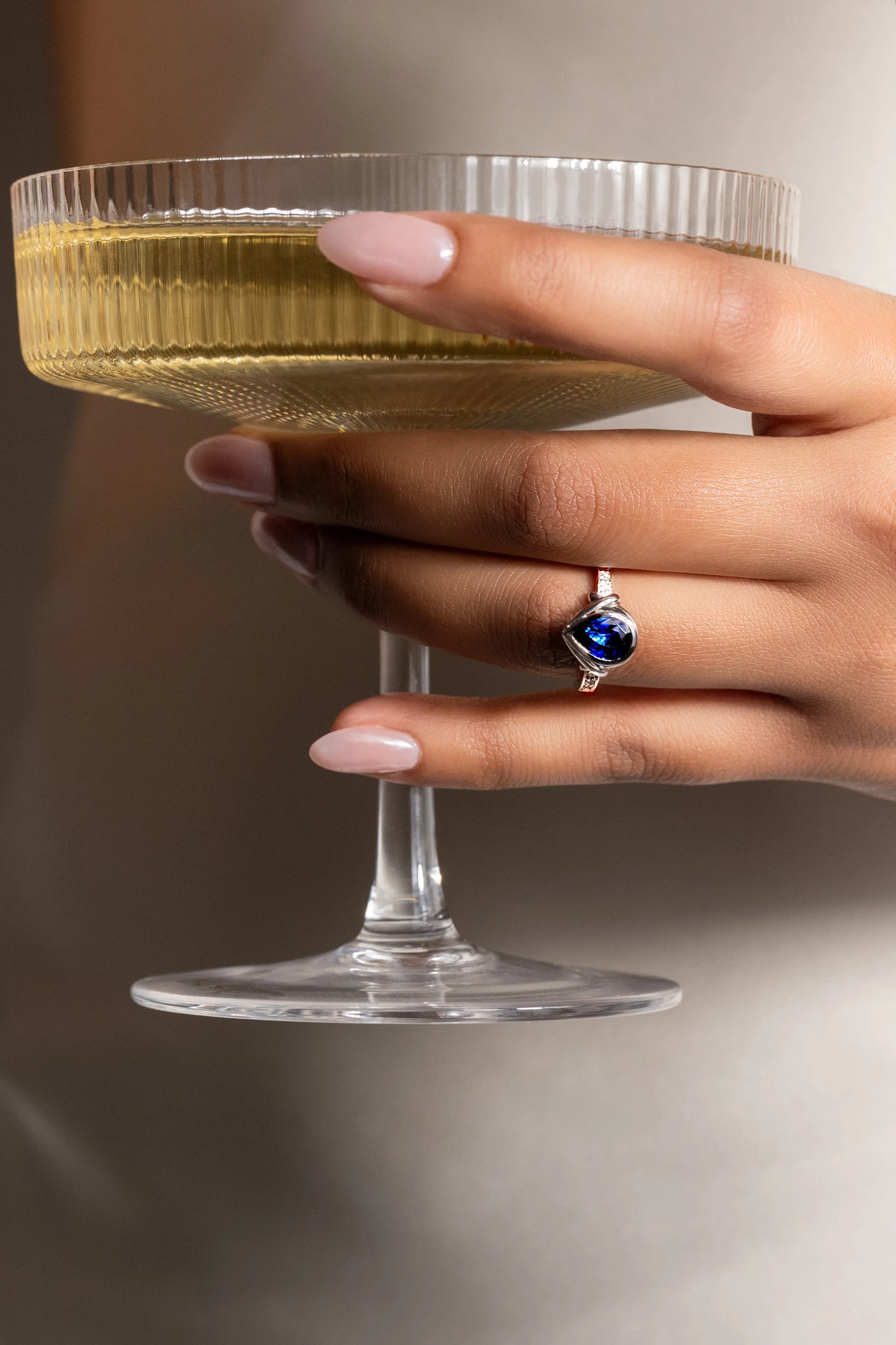 18K white gold ring featuring a 1.4ct Royal Blue Sapphire from Ceylon, set in a bezel with 10 SI/G diamonds (0.07ct), blending luxury and durability for everyday elegance.