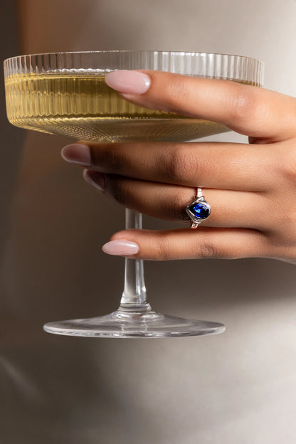 18K white gold ring featuring a 1.4ct Royal Blue Sapphire from Ceylon, set in a bezel with 10 SI/G diamonds (0.07ct), blending luxury and durability for everyday elegance.
