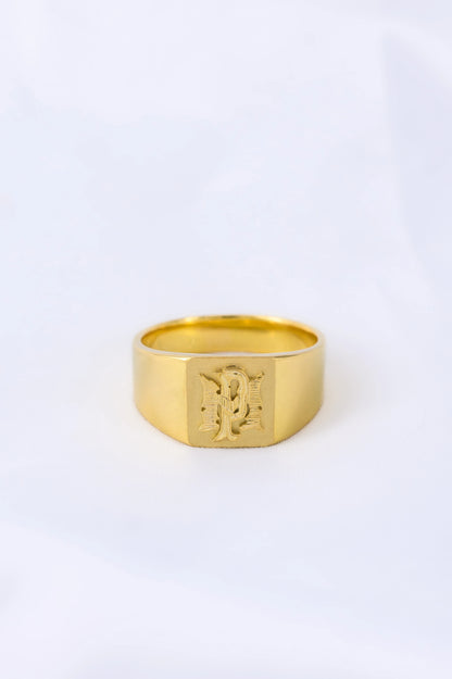 Custom 18K gold signet ring with personalized pattern, crafted to reflect heritage and boldness, a timeless family heirloom.