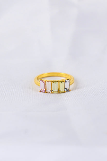 Bespoke anniversary ring crafted with soft pastel sapphires, a personal and meaningful celebration of love and enduring connection.